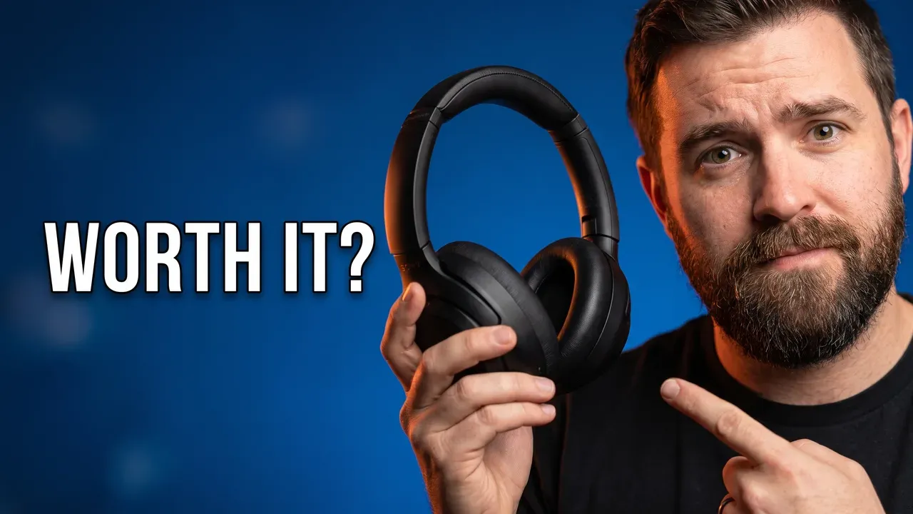 AI-generated thumbnail: a bearded reviewer holds up black over-ear headphones and points at them, with the words WORTH IT?